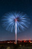 Stars rise above the Ocotillo Wind Turbine power generation facility, with a flashlight illuminating the turning turbine blades. Image #30221