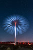 Stars rise above the Ocotillo Wind Turbine power generation facility, with a flashlight illuminating the turning turbine blades. Image #30222