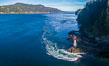 Seymour Narrows with strong tidal currents.  Between Vancouver Island and Quadra Island, Seymour Narrows is about 750 meters wide and has currents reaching 15 knots.  Aerial photo. British Columbia, Canada. Image #34474