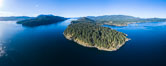 Seymour Narrows, between Vancouver Island and Quadra Island, Seymour Narrows is about 750 meters wide and has currents reaching 15 knots.  Aerial photo. British Columbia, Canada. Image #34493
