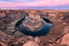 Spectacular Horseshoe Bend sunrise. The Colorado River makes a 180-degree turn at Horseshoe Bend. Here the river has eroded the Navajo sandstone for eons, digging a canyon 1100-feet deep. Page, Arizona, USA. Image #35939