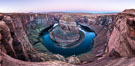 Predawn light on Horseshoe Bend. The Colorado River makes a 180-degree turn at Horseshoe Bend. Here the river has eroded the Navajo sandstone for eons, digging a canyon 1100-feet deep. Page, Arizona, USA. Image #36005