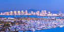 San Diego City Skyline at Sunset, viewed from Point Loma, Shelter Island Yacht Club in the foreground, San Diego Bay, Mount San Miguel (right) and Lyons Peak (left) in distance, panoramic photograph. California, USA. Image #36750
