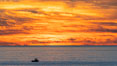 Fiery Sunset and Fishing Boat at Sea, Carlsbad. California, USA. Image #37481