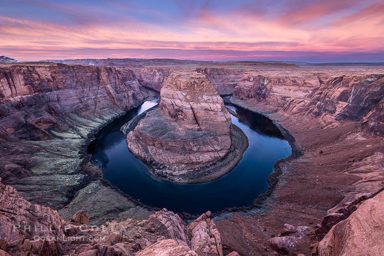 Spectacular Horseshoe Bend sunrise. The Colorado River makes a 180-degree turn at Horseshoe Bend. Here the river has eroded the Navajo sandstone for eons, digging a canyon 1100-feet deep