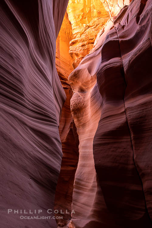 Canyon X, a spectacular slot canyon near Page, Arizona.  Slot canyons are formed when water and wind erode a cut through a (usually sandstone) mesa, producing a very narrow passage that may be as slim as a few feet and a hundred feet or more in height.