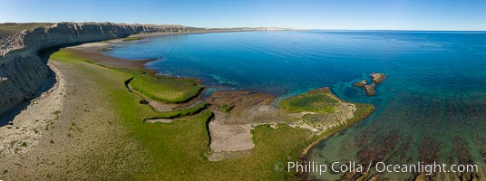 Aerial panorama of sea cliffs and Golfo Nuevo, near Puerto Piramides, Argentina, Eubalaena australis