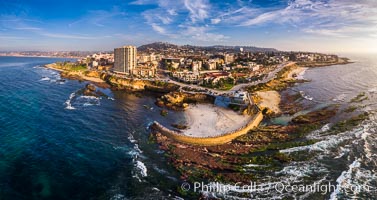 Aerial Panoramic Photo of Children's Pool, Casa Cove and La Jolla Coastline. The underwater reef is exposed by extreme low tide.