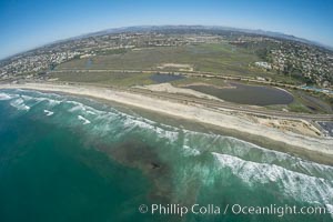 Aerial Photo of San Elijo Lagoon and Cardiff Reef beach. San Elijo Lagoon Ecological Reserve is one of the largest remaining coastal wetlands in San Diego County, California, on the border of Encinitas, Solana Beach and Rancho Santa Fe