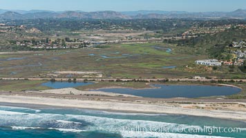 Aerial Photo of San Elijo Lagoon and Cardiff Reef beach. San Elijo Lagoon Ecological Reserve is one of the largest remaining coastal wetlands in San Diego County, California, on the border of Encinitas, Solana Beach and Rancho Santa Fe