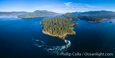 Seymour Narrows with strong tidal currents.  Between Vancouver Island and Quadra Island, Seymour Narrows is about 750 meters wide and has currents reaching 15 knots.  Aerial photo.