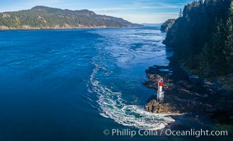 Seymour Narrows with strong tidal currents.  Between Vancouver Island and Quadra Island, Seymour Narrows is about 750 meters wide and has currents reaching 15 knots.  Aerial photo.