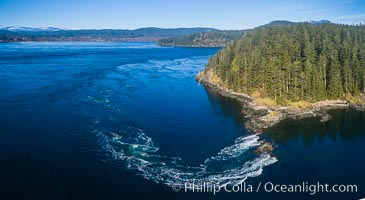 Seymour Narrows with strong tidal currents.  Between Vancouver Island and Quadra Island, Seymour Narrows is about 750 meters wide and has currents reaching 15 knots.  Aerial photo