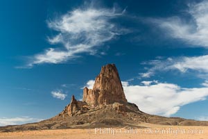 Agaltha Peak, also know as El Capitan Peak, rises to over 1500' in height near Kayenta, Arizona and Monument Valley.  Agathla Peak is an eroded volcanic plug consisting of volcanic breccia cut by dikes of an unusual igneous rock called minette.