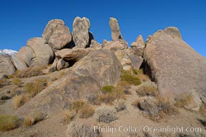 The Alabama Hills, with characteristic curious eroded rock formations formed of ancient granite and metamorphosed rock, next to the Sierra Nevada mountains and the town of Lone Pine, Alabama Hills Recreational Area