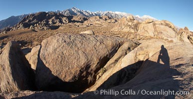 The Alabama Hills, with characteristic curious eroded rock formations formed of ancient granite and metamorphosed rock, next to the Sierra Nevada mountains and the town of Lone Pine, Alabama Hills Recreational Area