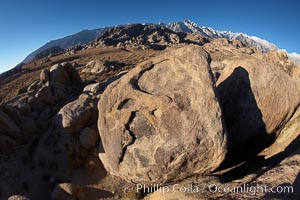 The Alabama Hills, with characteristic curious eroded rock formations formed of ancient granite and metamorphosed rock, next to the Sierra Nevada mountains and the town of Lone Pine, Alabama Hills Recreational Area