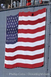 American flag, huge, hanging on the side of a Navy ship, San Diego, California