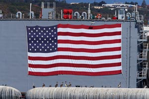 American flag, huge, hanging on the side of a Navy ship, San Diego, California