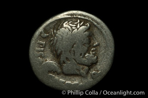 Ancient Roman coin, minted by L.C. Piso / Q.S. Caaepio (100 B.C.), (silver, denom/type: Denarius) (Denarius Cr-330/1, Syd-603, Calpurnia-5. Obverse: Head of Saturn right. Reverse: The two quaesters standing left, between two ears of corn.)