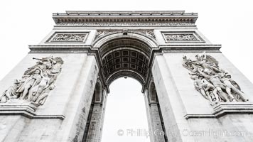 Arc de Triomphe. The Arc de Triomphe (Arc de Triomphe de l'Etoile) is one of the most famous monuments in Paris. It stands in the centre of the Place Charles de Gaulle (originally named Place de l'Etoile), at the western end of the Champs-Elysees. The Arc de Triomphe (in English: "Triumphal Arch") honors those who fought and died for France in the French Revolutionary and the Napoleonic Wars, with the names of all French victories and generals inscribed on its inner and outer surfaces. Beneath its vault lies the Tomb of the Unknown Soldier from World War I. The monument was designed by Jean Chalgrin in 1806, and its iconographic program pitted heroically nude French youths against bearded Germanic warriors in chain mail. It set the tone for public monuments, with triumphant patriotic messages. The monument stands 50 metres (164 ft) in height, 45 m (148 ft) wide and 22 m (72 ft) deep., natural history stock photograph, photo id 28265