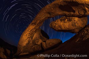 Arch Rock and star trails, impending dawn, Joshua Tree National Park, California