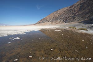 Badwater, California.  Badwater, at 282 feet below sea level, is the lowest point in North America.  9000 square miles of watershed drain into the Badwater basin, to dry and form huge white salt flats, Death Valley National Park