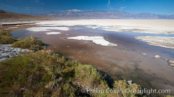 Badwater, California.  Badwater, at 282 feet below sea level, is the lowest point in North America.  9000 square miles of watershed drain into the Badwater basin, to dry and form huge white salt flats, Death Valley National Park