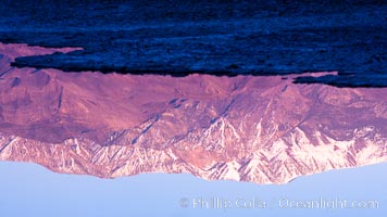 Sunrise lights Telescope Peak as it rises over the salt flats of Badwater, Death Valley.  At 11,049 feet, Telescope Peak is the highest peak in the Panamint Range as well as the highest point in Death Valley National Park.  At 282 feet below sea level, Badwater is the lowest point in North America