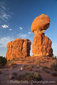 Balanced Rock, a narrow sandstone tower, appears poised to topple, Arches National Park, Utah
