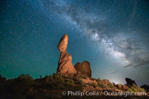 Balanced Rock and Milky Way stars at night.