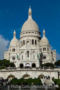 Sacre-Coeur Basilica.  The Basilica of the Sacred Heart of Paris, commonly known as Sacre-Coeur Basilica, is a Roman Catholic church and minor basilica, dedicated to the Sacred Heart of Jesus, in Paris, France. A popular landmark, the basilica is located at the summit of the butte Montmartre, the highest point in the city.