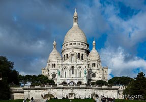 Sacre-Coeur Basilica.  The Basilica of the Sacred Heart of Paris, commonly known as Sacre-Coeur Basilica, is a Roman Catholic church and minor basilica, dedicated to the Sacred Heart of Jesus, in Paris, France. A popular landmark, the basilica is located at the summit of the butte Montmartre, the highest point in the city.