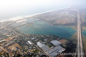 Batiquitos Lagoon aerial view, showing coastline and Interstate 5 freeway.