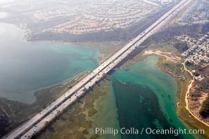 Batiquitos Lagoon aerial view, showing coastline and Interstate 5 freeway.