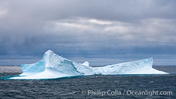 Iceberg, ocean, light and clouds.  Light plays over icebergs and the ocean near Coronation Island.