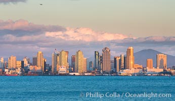 San Diego city skyline, dusk, clearing storm clouds