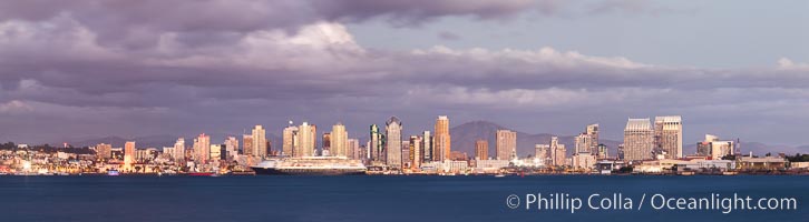 San Diego city skyline, dusk, clearing storm clouds