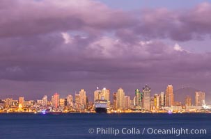 San Diego city skyline, dusk, clearing storm clouds