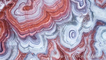 Fantastic colorful sedimentary patterns, Bentonite layers are seen as striations exposed in the Utah Badlands, part of the Chinle Formation formed during the Upper Triassic Period.  Aerial photograph.