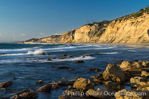 Black's Beach sea cliffs, sunset, looking north from Scripps Pier with Torrey Pines State Reserve in the distance