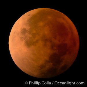 Blood red moon.  During total eclipse the moon lies in the full shadow of the earth (umbra) and receives only faint, red-tinged light -- sunlight which is refracted through the thin layer of smoke- and haze-filled air that is Earth's atmosphere.  August 28, 2007, Earth Orbit, Solar System, Milky Way Galaxy, The Universe