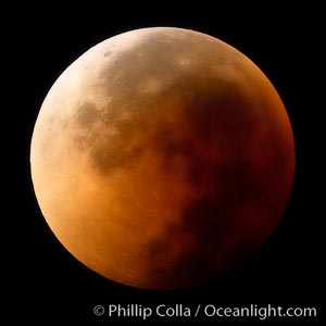 Blood red moon.  During total eclipse the moon lies in the full shadow of the earth (umbra) and receives only faint, red-tinged light -- sunlight which is refracted through the thin layer of smoke- and haze-filled air that is Earth's atmosphere.  August 28, 2007, Earth Orbit, Solar System, Milky Way Galaxy, The Universe