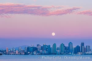 Blue Moon at Sunset over San Diego City Skyline.  The third full moon in a season, this rare "blue moon" rises over San Diego just after sundown
