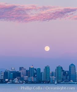 Blue Moon at Sunset over San Diego City Skyline.  The third full moon in a season, this rare "blue moon" rises over San Diego just after sundown