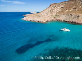 Boat Ambar and School of Fish, Ensenada el Embudo, Isla Partida, aerial photo