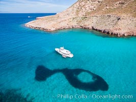 Boat Ambar and School of Fish, Ensenada el Embudo, Isla Partida. aerial photo