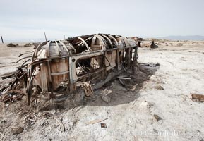 Bombay Beach, lies alongside and below the flood level of the Salton Sea, so that it floods occasionally when the Salton Sea rises.  A part of Bombay Beach is composed of derelict old trailer homes, shacks and wharfs, slowly sinking in the mud and salt, Imperial County, California