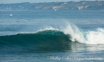 Boomer Beach wave, winter swell, La Jolla, Black's Beach and Torrey Pines in the distance