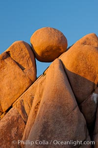 Boulders and sunset in Joshua Tree National Park.  The warm sunlight gently lights unusual boulder formations at Jumbo Rocks in Joshua Tree National Park, California